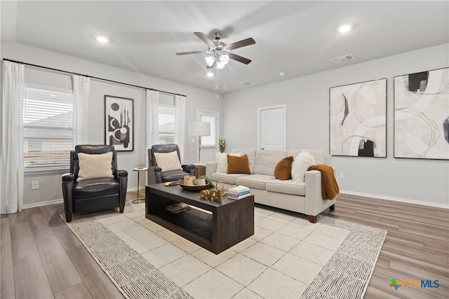 living room with ceiling fan, light wood-style flooring, recessed lighting, visible vents, and baseboards