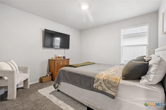 carpeted bedroom with baseboards