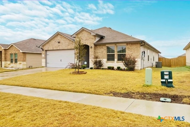 single story home featuring central AC unit, a garage, fence, driveway, and a front lawn