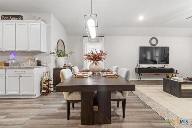 dining space featuring light wood-type flooring