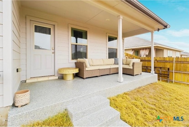 view of patio / terrace featuring fence and an outdoor hangout area