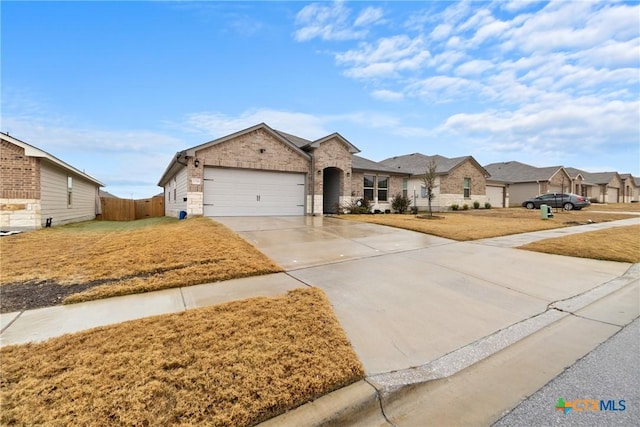 view of front facade featuring a garage and a front yard