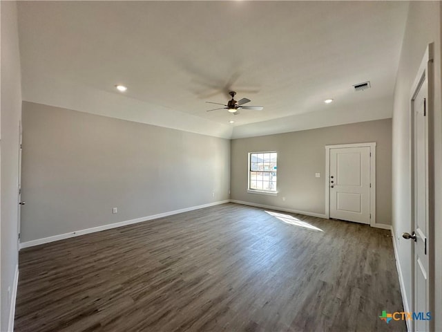 unfurnished room featuring dark hardwood / wood-style flooring and ceiling fan