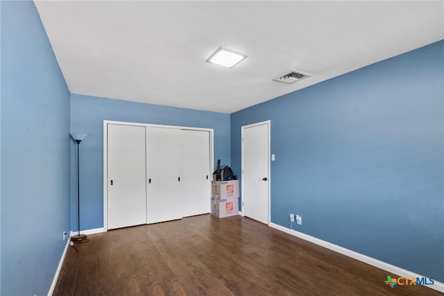 2506 Bon Aire Ave, Victoria, TX 77901 - unfurnished bedroom featuring wood finished floors, baseboards, and a closet