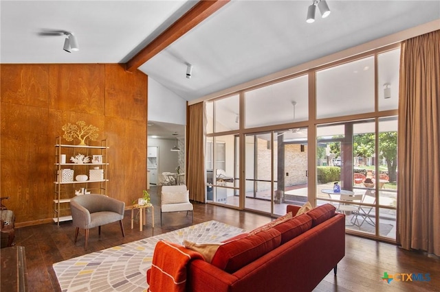 2506 Bon Aire Ave, Victoria, TX 77901 - living area featuring wood-type flooring, high vaulted ceiling, beamed ceiling, and wooden walls