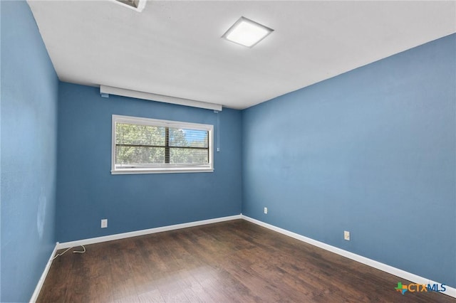 2506 Bon Aire Ave, Victoria, TX 77901 - empty room with wood finished floors and baseboards