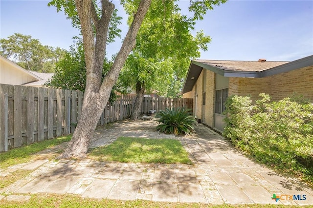 2506 Bon Aire Ave, Victoria, TX 77901 - fenced backyard featuring a patio