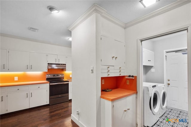 2506 Bon Aire Ave, Victoria, TX 77901 - laundry area with washing machine and dryer, crown molding, cabinet space, dark wood-type flooring, and baseboards