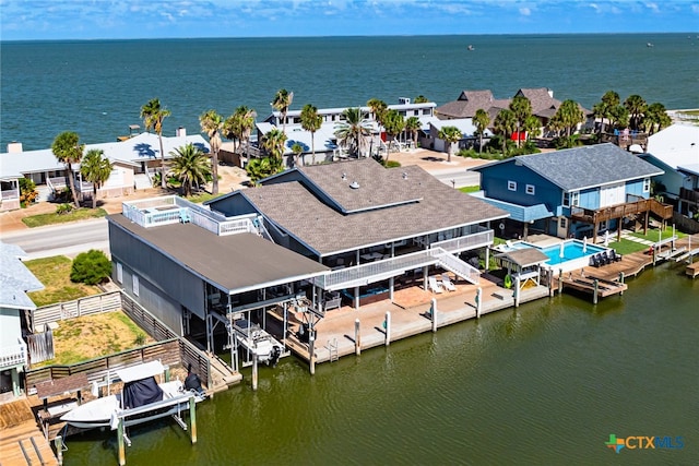 drone / aerial view with a water view