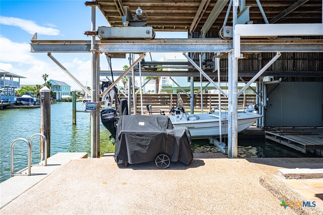 dock area with a water view