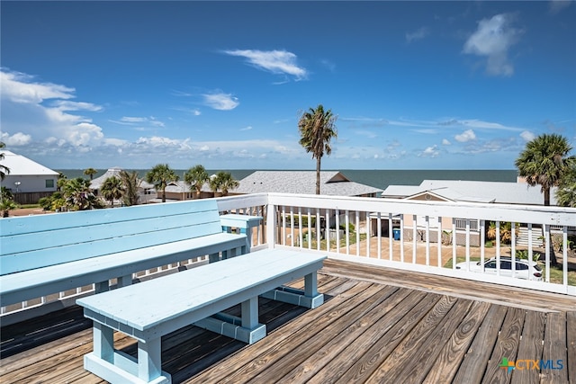 wooden deck with a water view