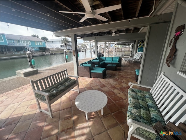 view of patio / terrace with ceiling fan, a pool, a water view, and an outdoor hangout area