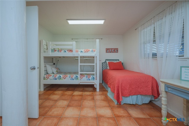 tiled bedroom with crown molding