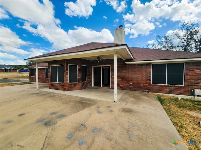 back of house with a patio area and ceiling fan