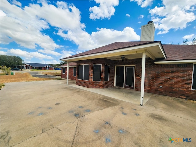 back of house featuring ceiling fan and a patio area