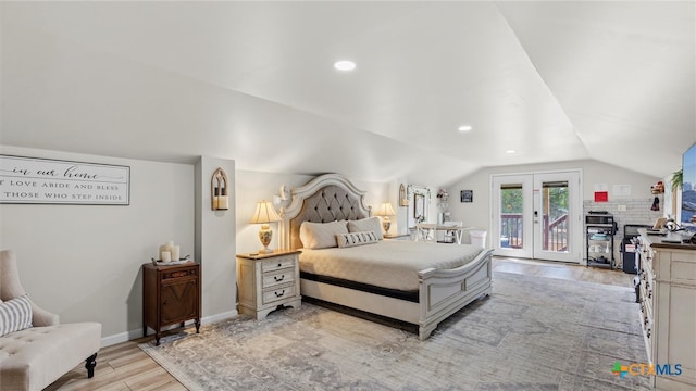 bedroom featuring french doors, access to exterior, light wood-type flooring, and lofted ceiling