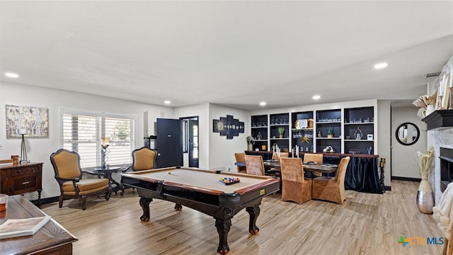 game room with billiards and light hardwood / wood-style flooring