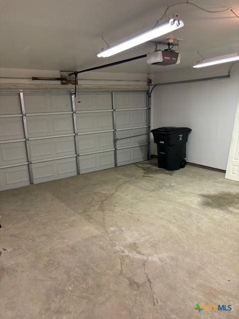 garage featuring a garage door opener