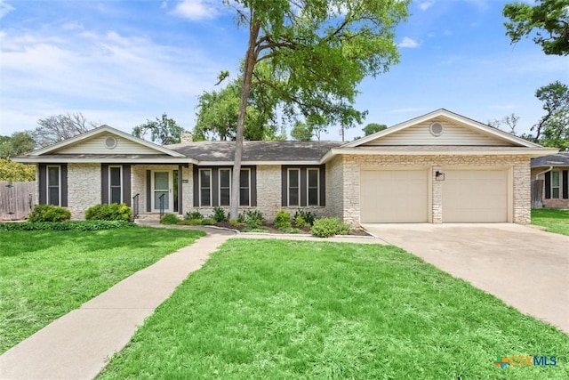 ranch-style home featuring a front lawn, driveway, a chimney, a garage, and brick siding