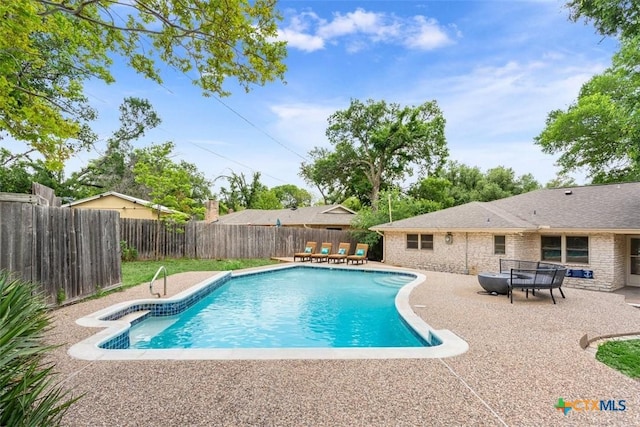 view of pool featuring a fenced backyard, a patio, and a fenced in pool