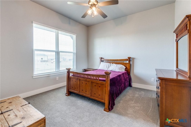 bedroom featuring ceiling fan and light carpet