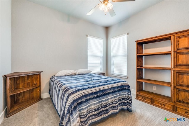 bedroom featuring ceiling fan and light colored carpet