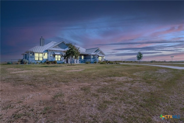 craftsman-style house with a lawn