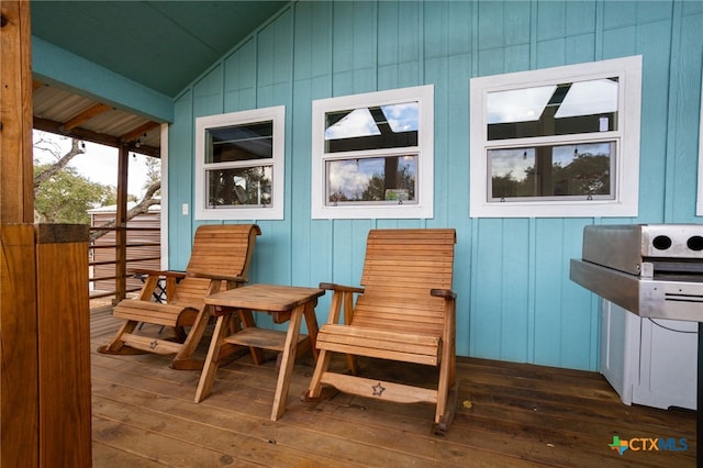 exterior space featuring vaulted ceiling