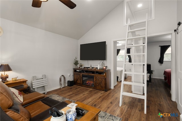 living room with high vaulted ceiling, dark hardwood / wood-style floors, and ceiling fan