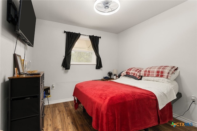 bedroom featuring dark wood-type flooring