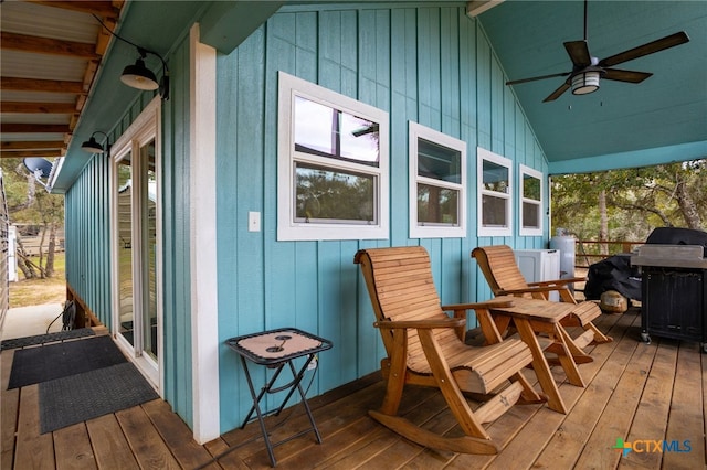 wooden deck featuring a grill and ceiling fan