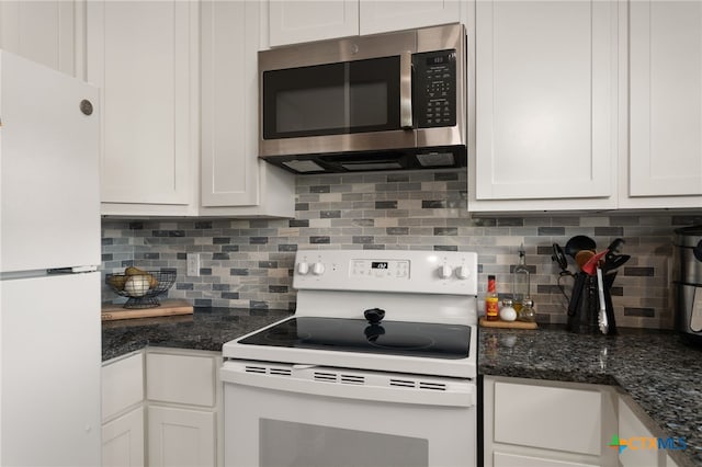 kitchen featuring white cabinetry, white appliances, and backsplash