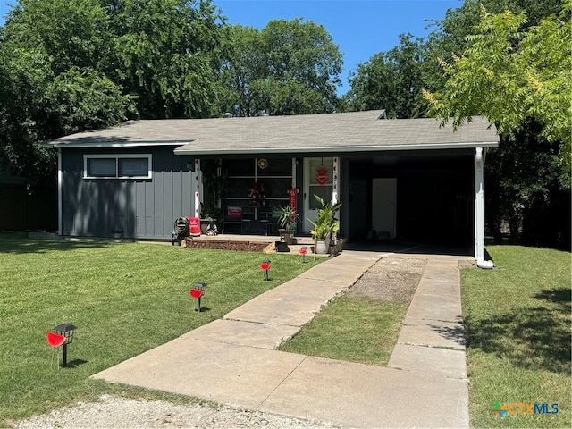 1506 S 39th St, Temple, TX 76504 - ranch-style home with concrete driveway, covered porch, a front yard, and board and batten siding