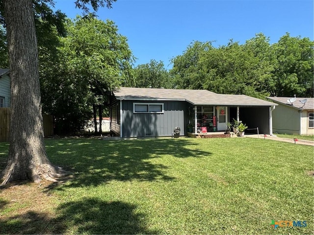 1506 S 39th St, Temple, TX 76504 - view of front of home featuring a front lawn, covered porch, and board and batten siding