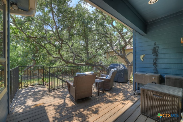 wooden terrace with area for grilling