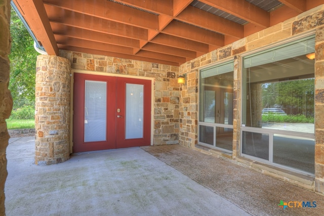 doorway to property featuring a patio area and french doors