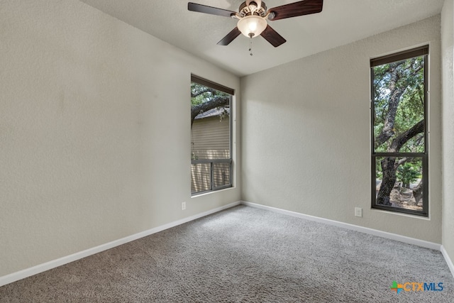 unfurnished room with carpet and ceiling fan