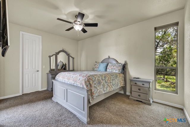 carpeted bedroom with ceiling fan