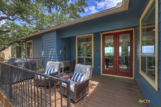 deck with grilling area and french doors