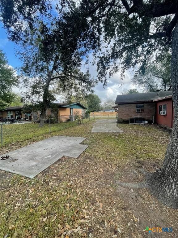 view of yard with a patio and fence