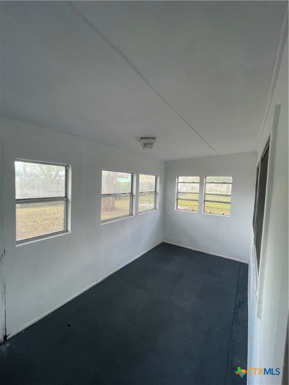 unfurnished sunroom with a wealth of natural light