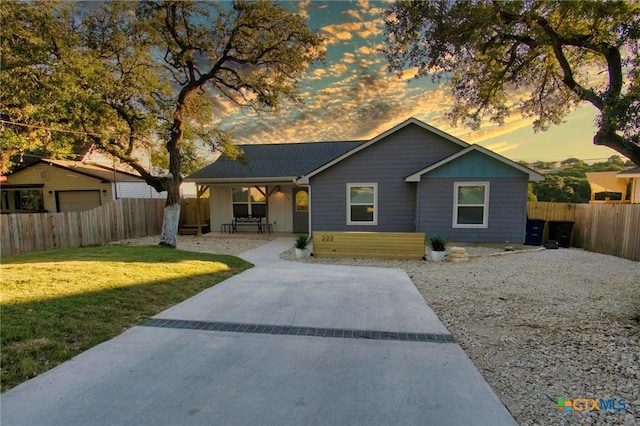 ranch-style home with a yard