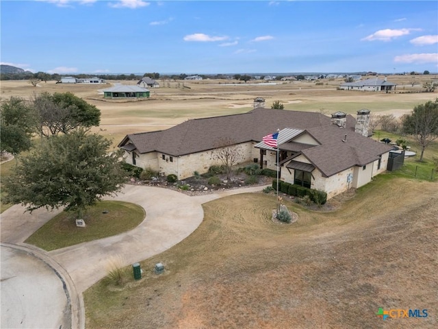 birds eye view of property featuring a rural view