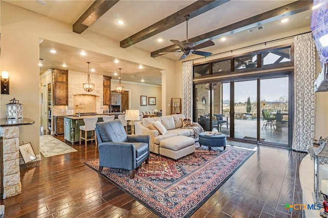 living area featuring ceiling fan, recessed lighting, visible vents, beamed ceiling, and dark wood finished floors