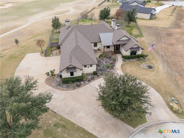 view of gate featuring a patio, a yard, a rural view, and a pergola