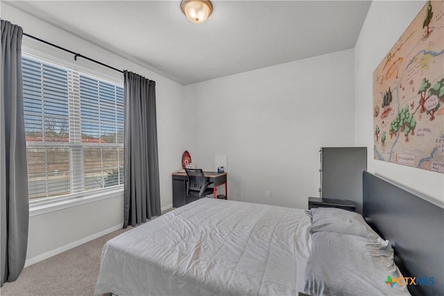 bedroom featuring light carpet