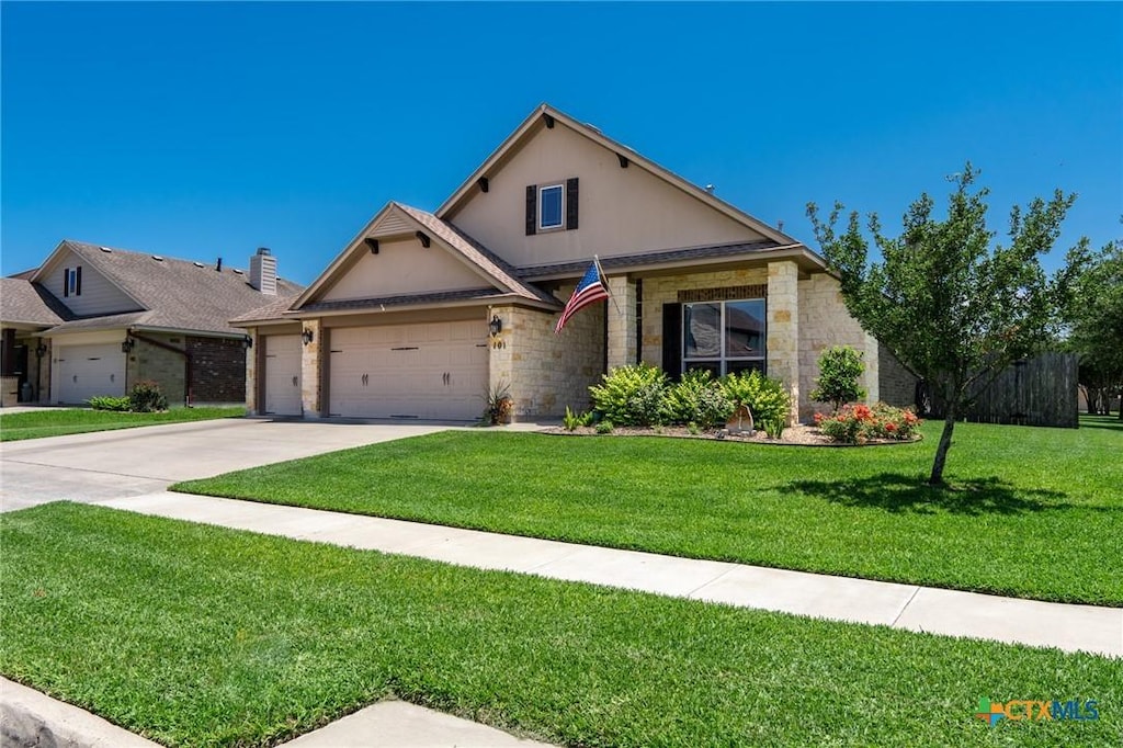 ranch-style home featuring a garage, driveway, a front yard, and stone siding