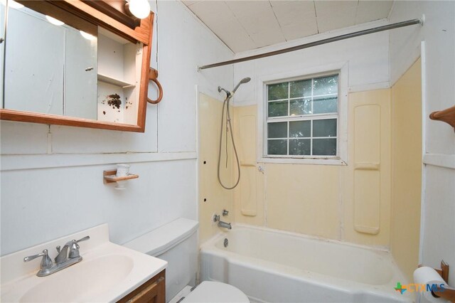 bathroom featuring vanity, toilet, and shower / bathtub combination