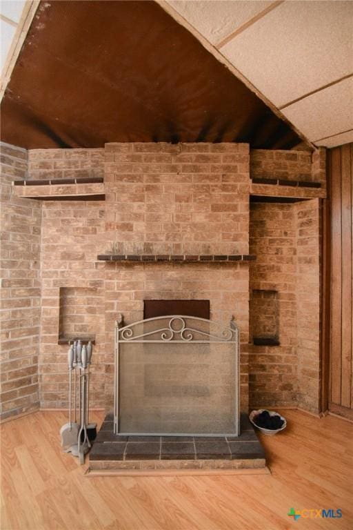 details with wood finished floors and a fireplace