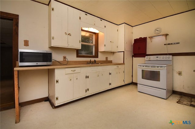 kitchen featuring light floors, electric range, light countertops, white cabinets, and stainless steel microwave